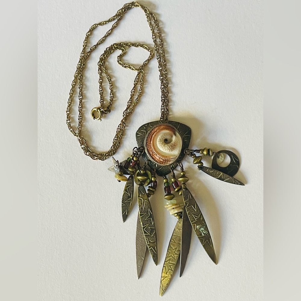 Boho Shell and Brass charm Necklace on vintage 12 k gf chain
